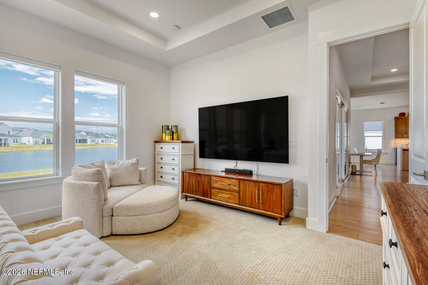 279 Bismarck Palm Road St. Augustine, FL 32092 - Photo 11 of 38 a living room with furniture and a flat screen tv