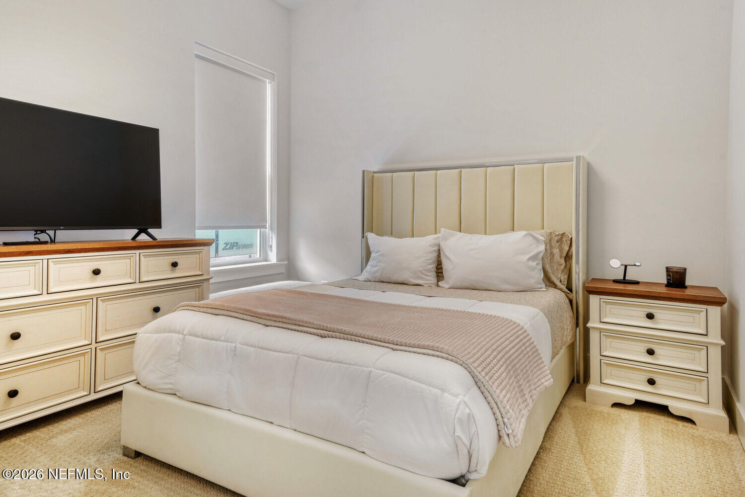279 Bismarck Palm Road St. Augustine, FL 32092 - Photo 16 of 38 a bedroom with a bed and a flat screen tv