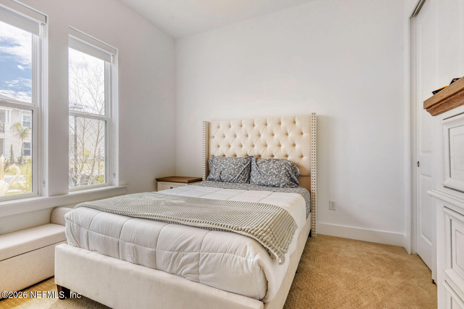 279 Bismarck Palm Road St. Augustine, FL 32092 - Photo 18 of 38 a bedroom with a large bed and a couch