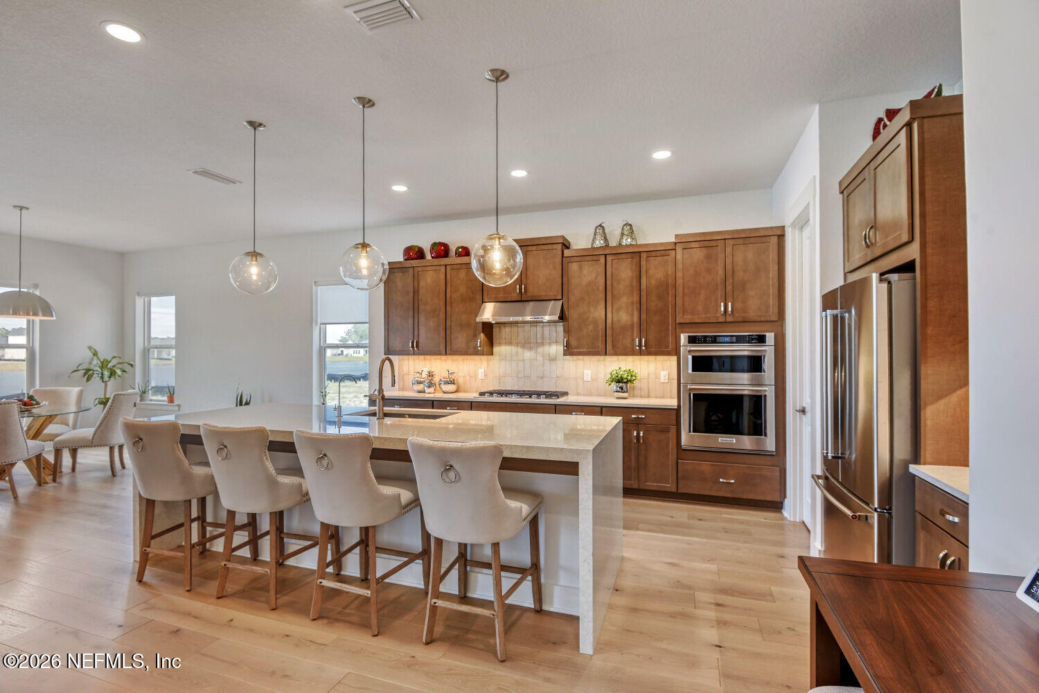 279 Bismarck Palm Road St. Augustine, FL 32092 - Photo 5 of 38 a large kitchen with a table and chairs