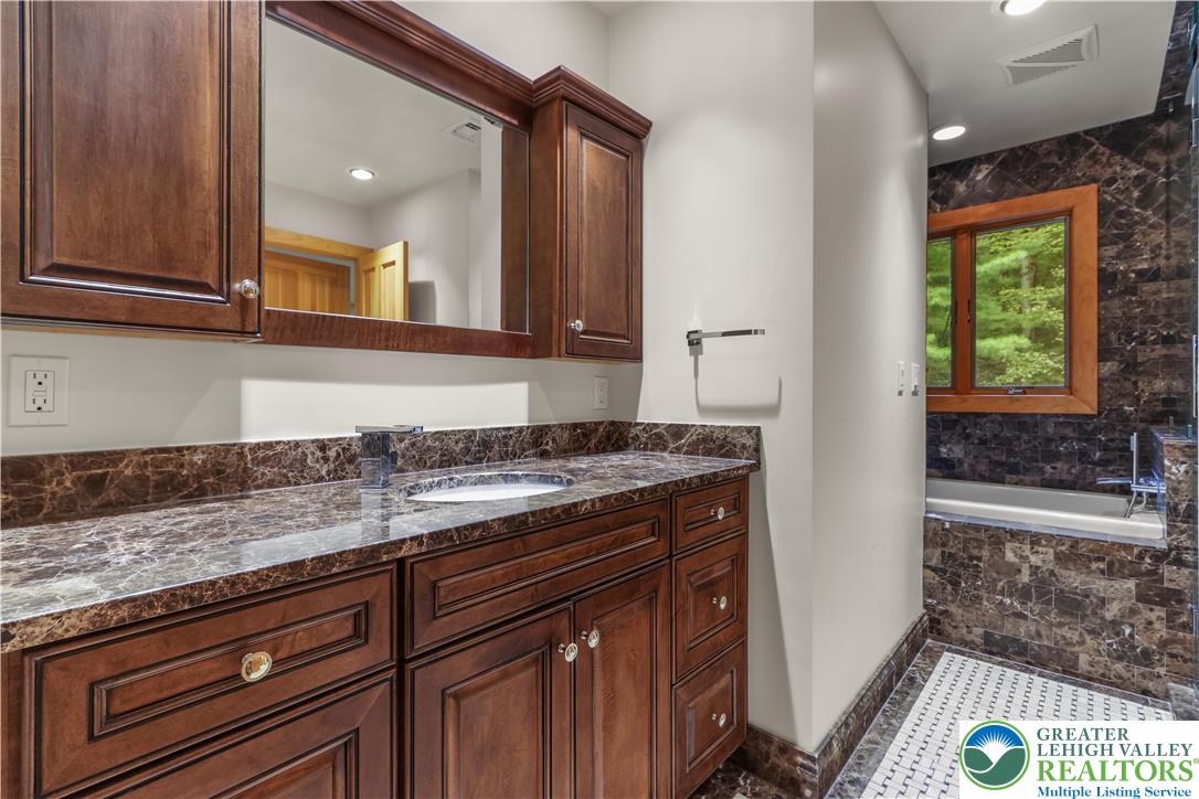 376 H T Y Road Kunkletown, PA 18058 - Photo 70 of 80 a kitchen with granite countertop a sink and a counter top space
