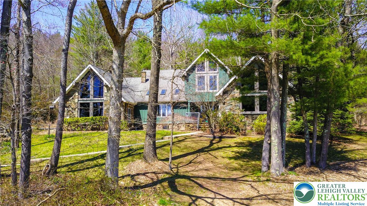 376 H T Y Road Kunkletown, PA 18058 - Photo 80 of 80 a view of a house with wooden fence next to a yard