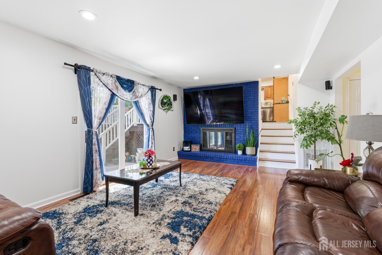 213 Normandy Road Edison, NJ 08820 - Photo 13 of 45 a living room with furniture and a wooden floor