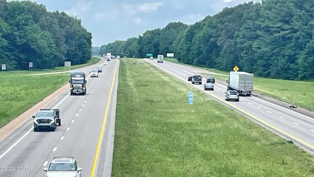 a view of a balcony with yard
