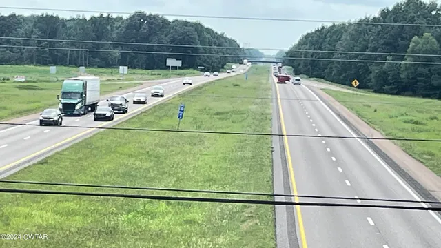 a view of a balcony with yard