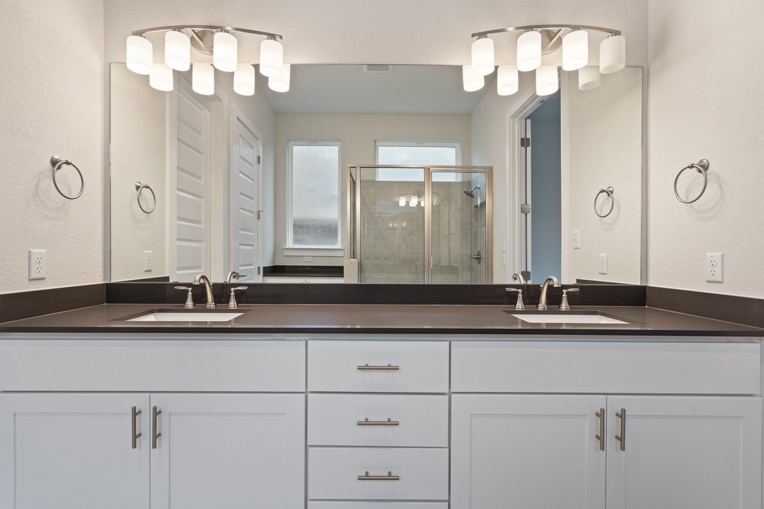 101 Old Wds Road Liberty Hill, TX 78642 - Photo 27 of 40 a bathroom with a sink and a mirror