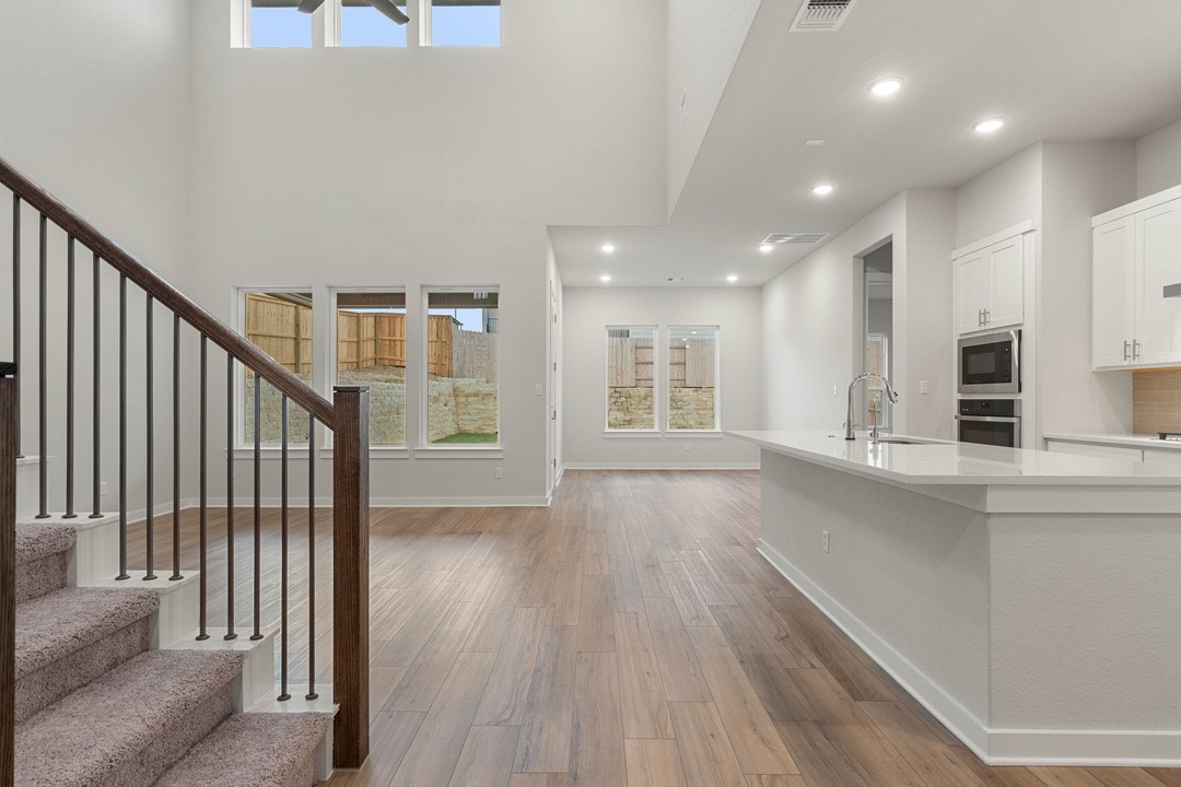101 Old Wds Road Liberty Hill, TX 78642 - Photo 5 of 40 a view of kitchen with furniture and wooden floor