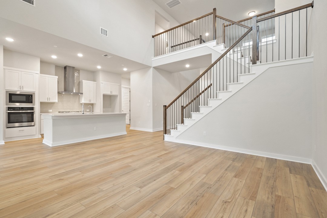 101 Old Wds Road Liberty Hill, TX 78642 - Photo 7 of 40 a view of kitchen with wooden floor and electronic appliances