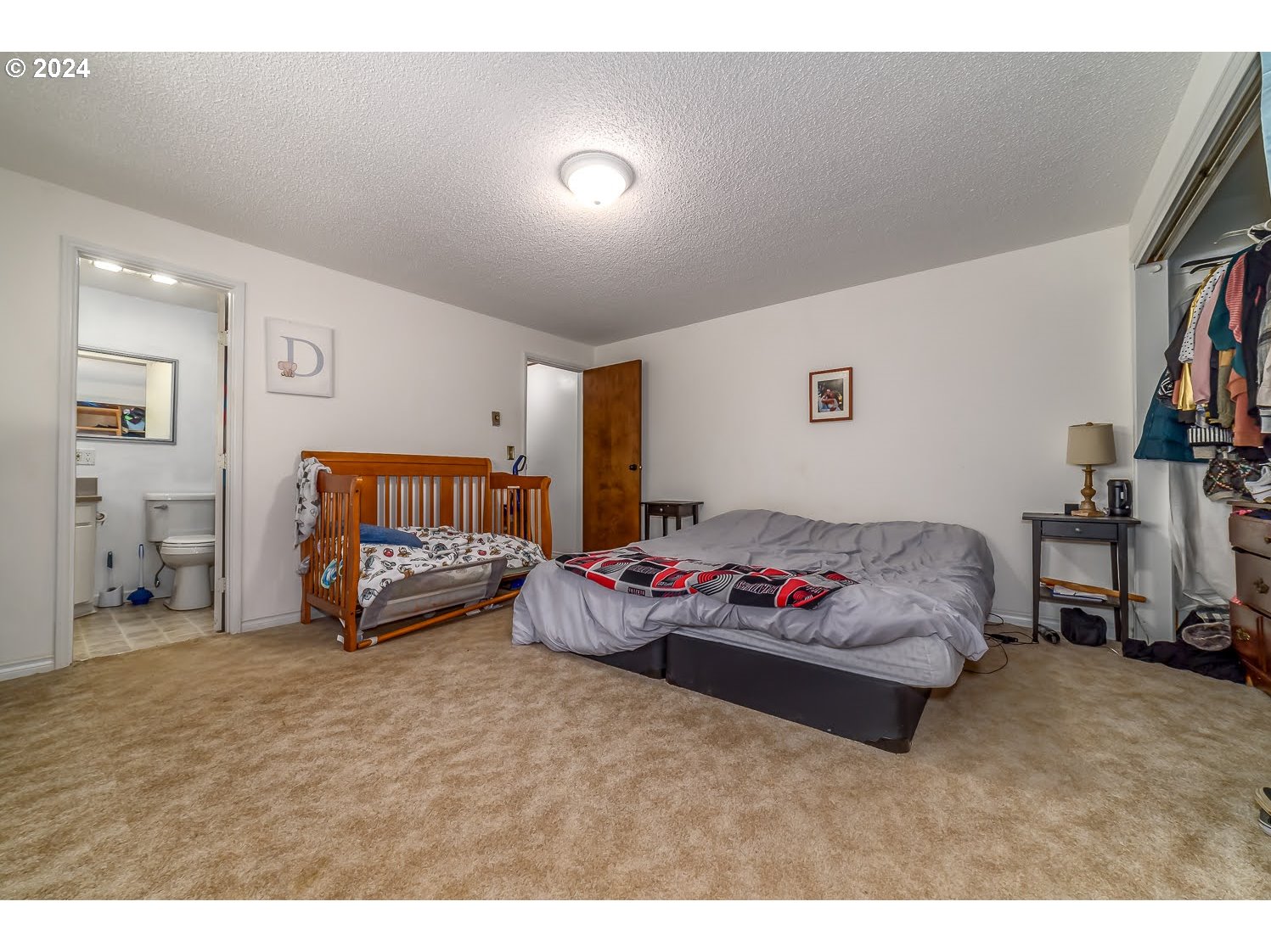 28149 Briggs Hill Road Eugene, OR 97405 - Photo 20 of 37 a bedroom with furniture and a book shelf