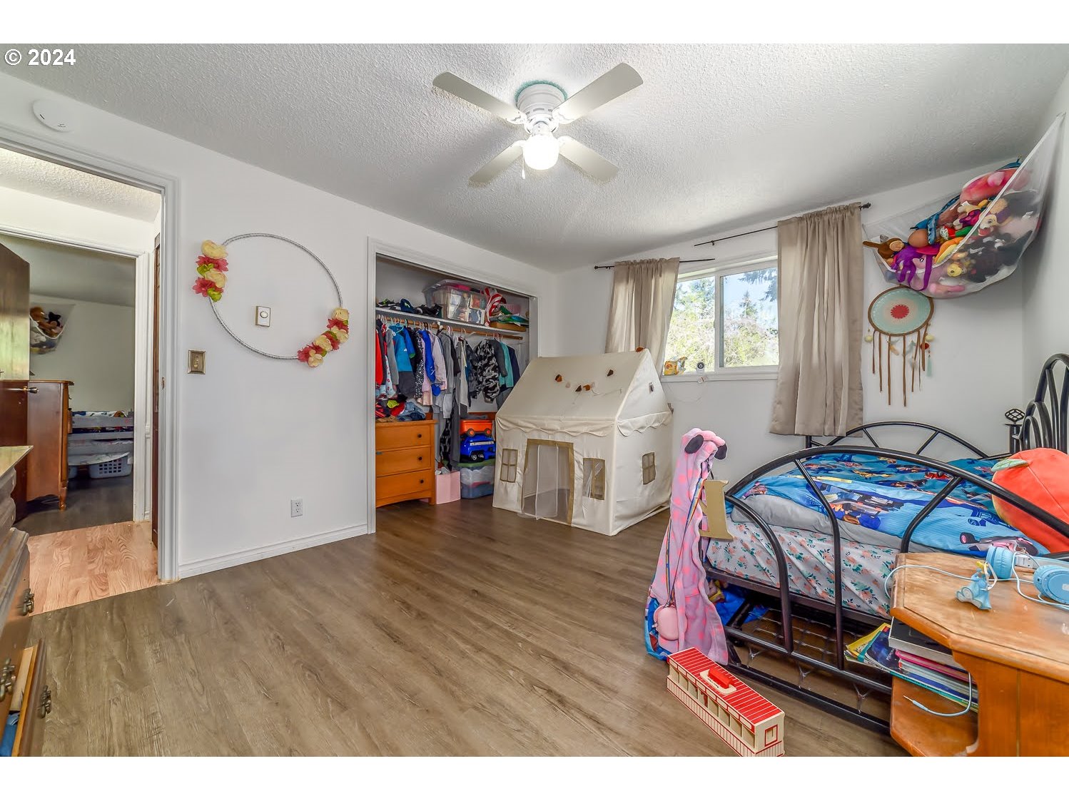 28149 Briggs Hill Road Eugene, OR 97405 - Photo 23 of 37 a bedroom with furniture and wooden floor