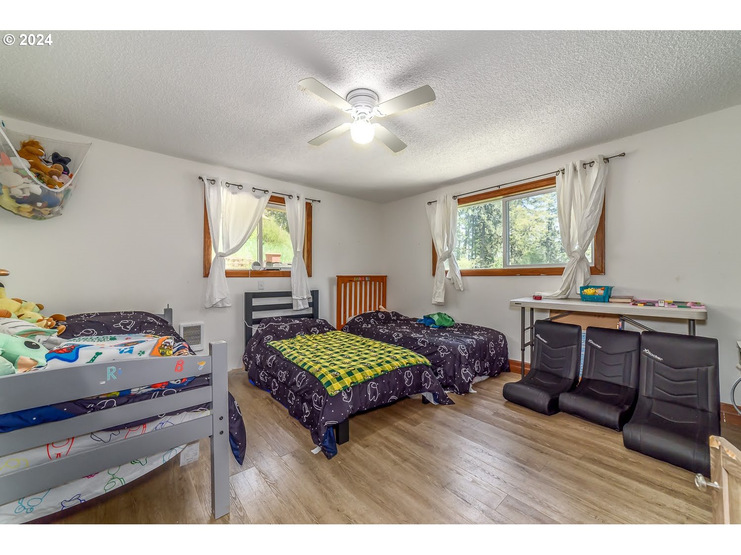 28149 Briggs Hill Road Eugene, OR 97405 - Photo 25 of 37 a living room with furniture and a baby crib