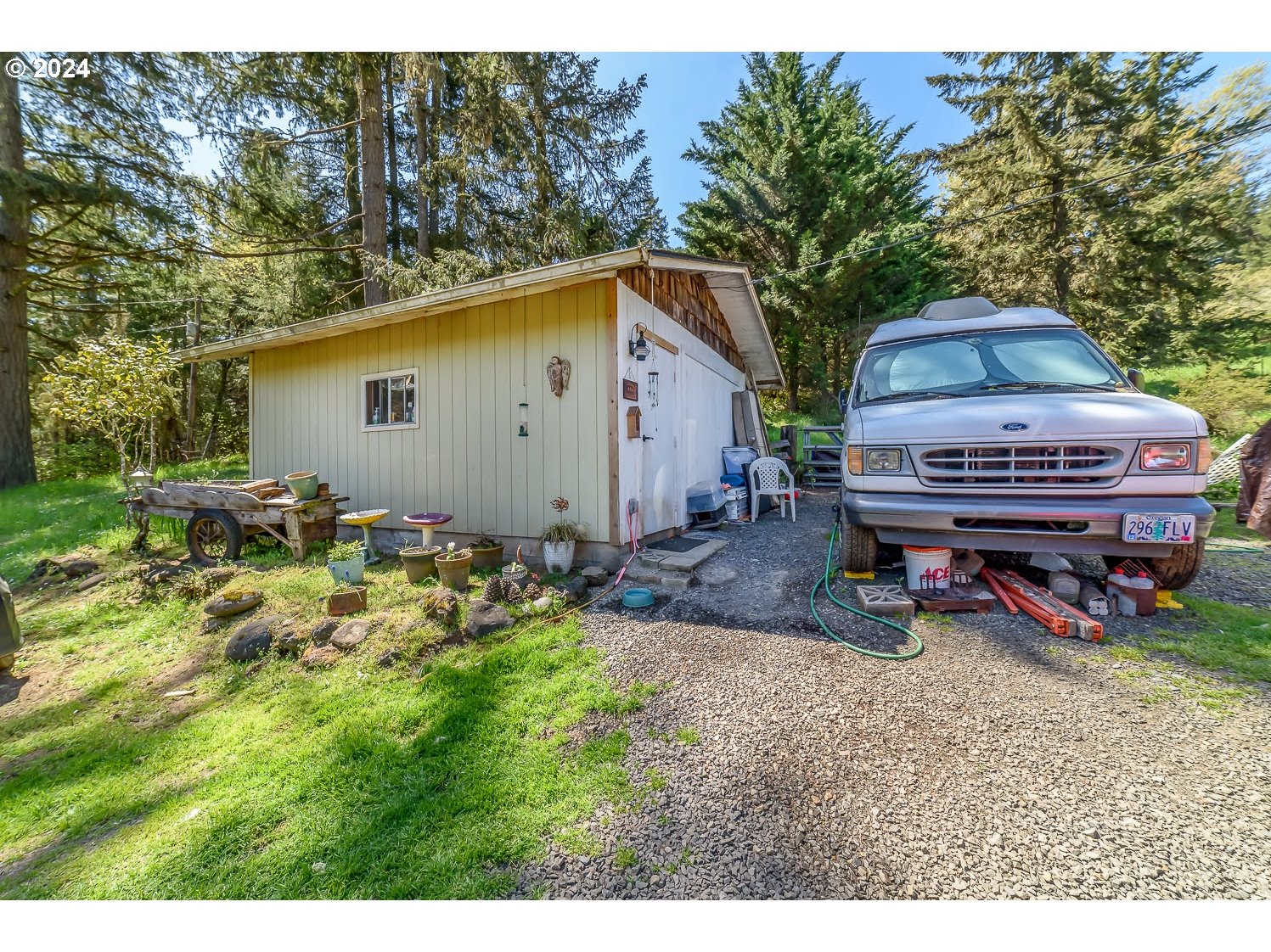 28149 Briggs Hill Road Eugene, OR 97405 - Photo 31 of 37 a backyard of a house with table and chairs