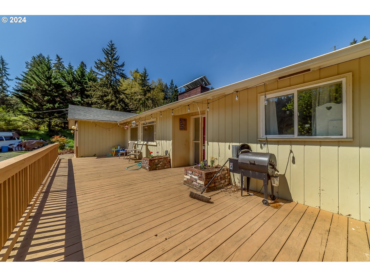 28149 Briggs Hill Road Eugene, OR 97405 - Photo 5 of 37 a balcony with wooden floor table and chairs