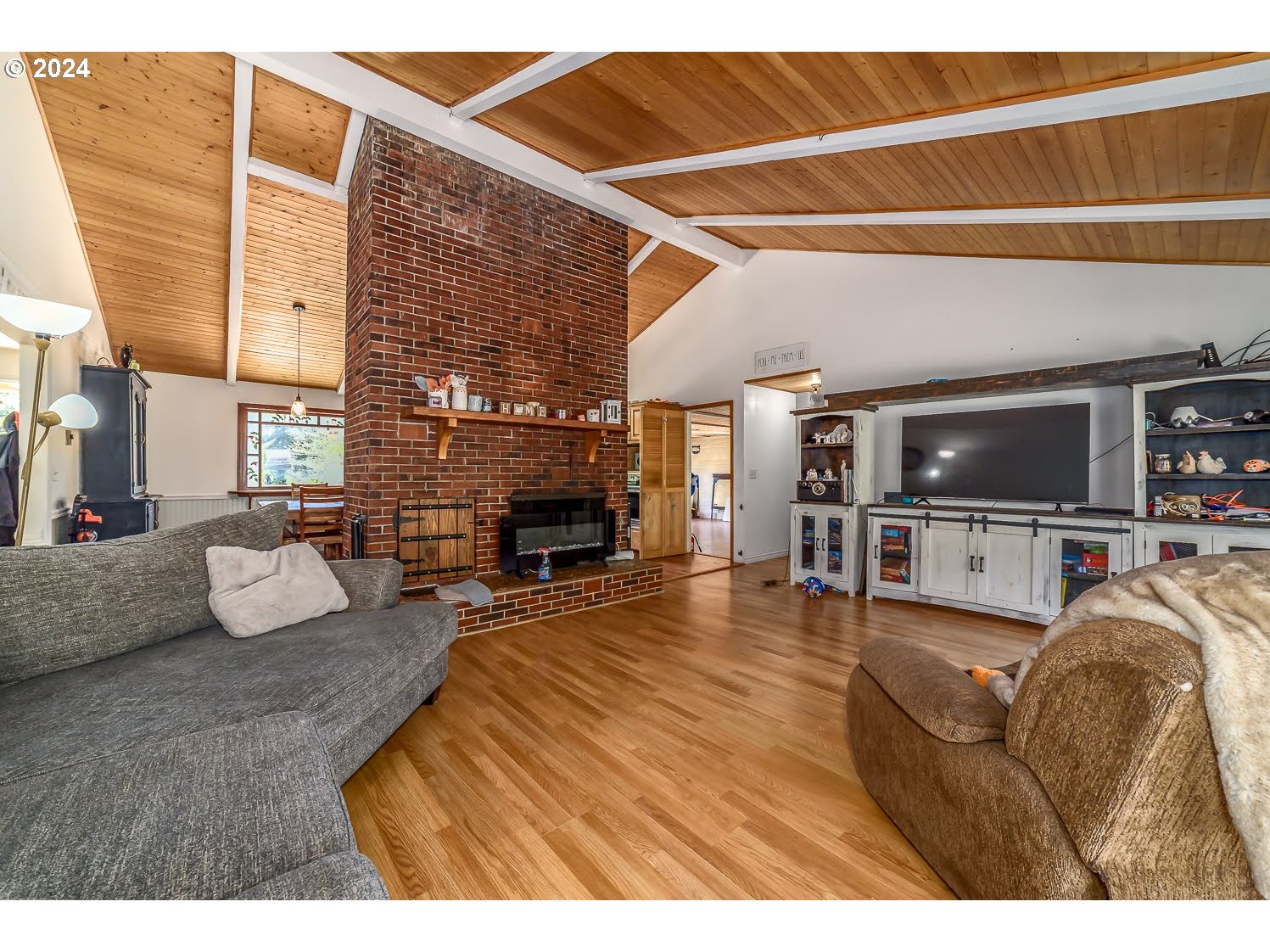 28149 Briggs Hill Road Eugene, OR 97405 - Photo 7 of 37 a living room with furniture and a flat screen tv