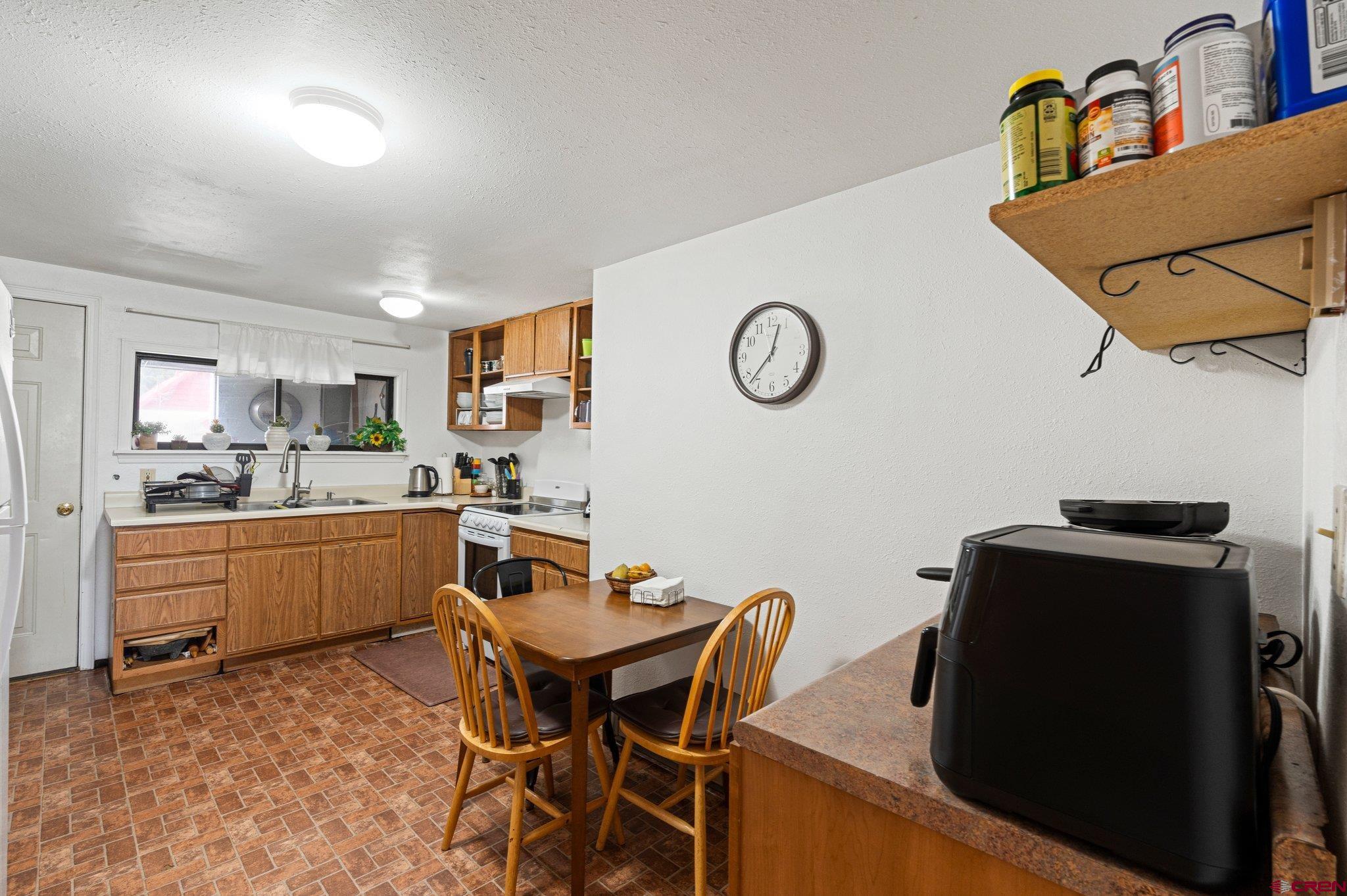 754 Greene Street, Unit A B C D Silverton, CO 81433 - Photo 15 of 31 a kitchen with a table and chairs in it