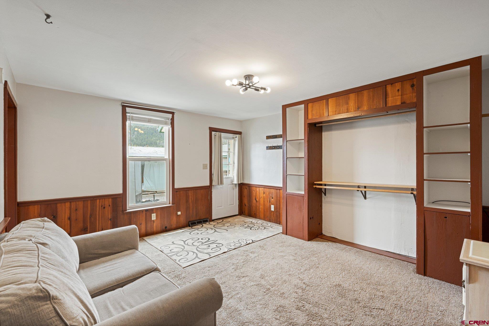 754 Greene Street, Unit A B C D Silverton, CO 81433 - Photo 18 of 31 a bedroom with furniture and a window