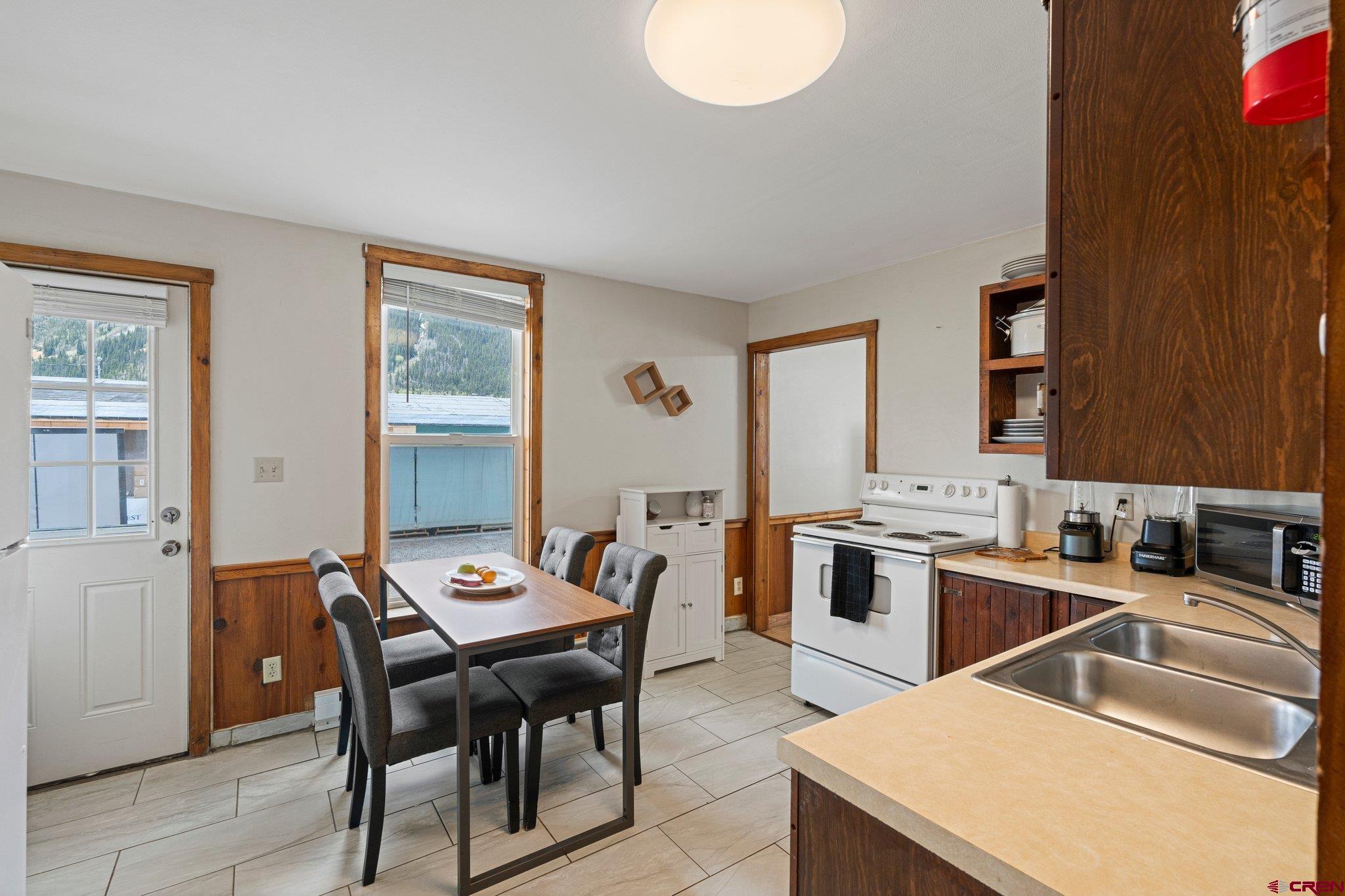 754 Greene Street, Unit A B C D Silverton, CO 81433 - Photo 6 of 31 a open kitchen with a table and chairs in it