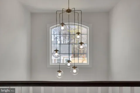 a spacious bedroom with a large bed and a dresser
