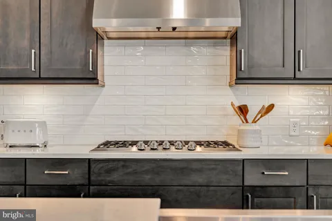 a living room with furniture a window and a clock