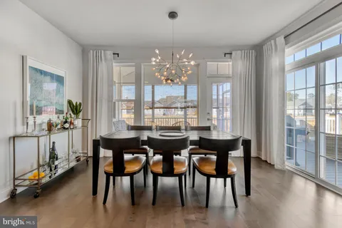 a view of a patio with table and chairs
