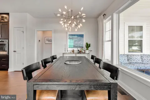 a front view of a house with a yard table and chairs
