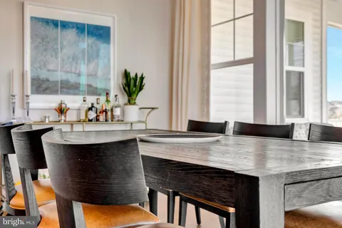 a front view of a house with a yard table and chairs
