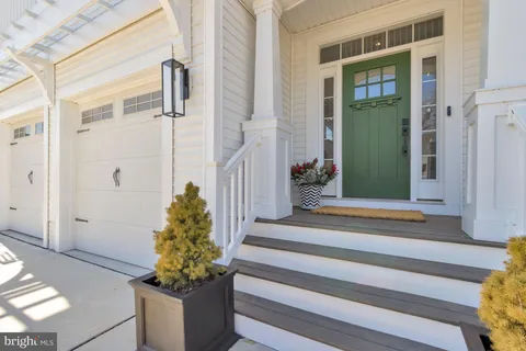 a living room with furniture a rug and a fireplace