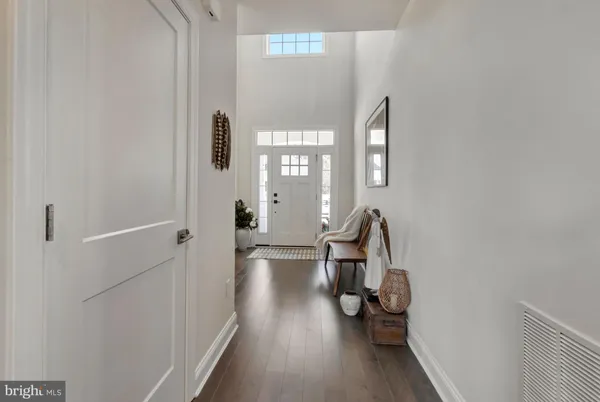 a living room with furniture a large window and a flat screen tv
