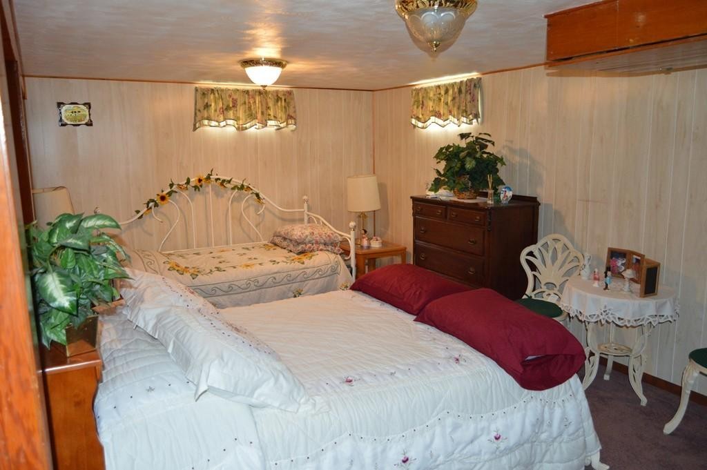 23 Fredette Street Springfield, MA 01109 - Photo 13 of 14 a bedroom with bed and a potted plant