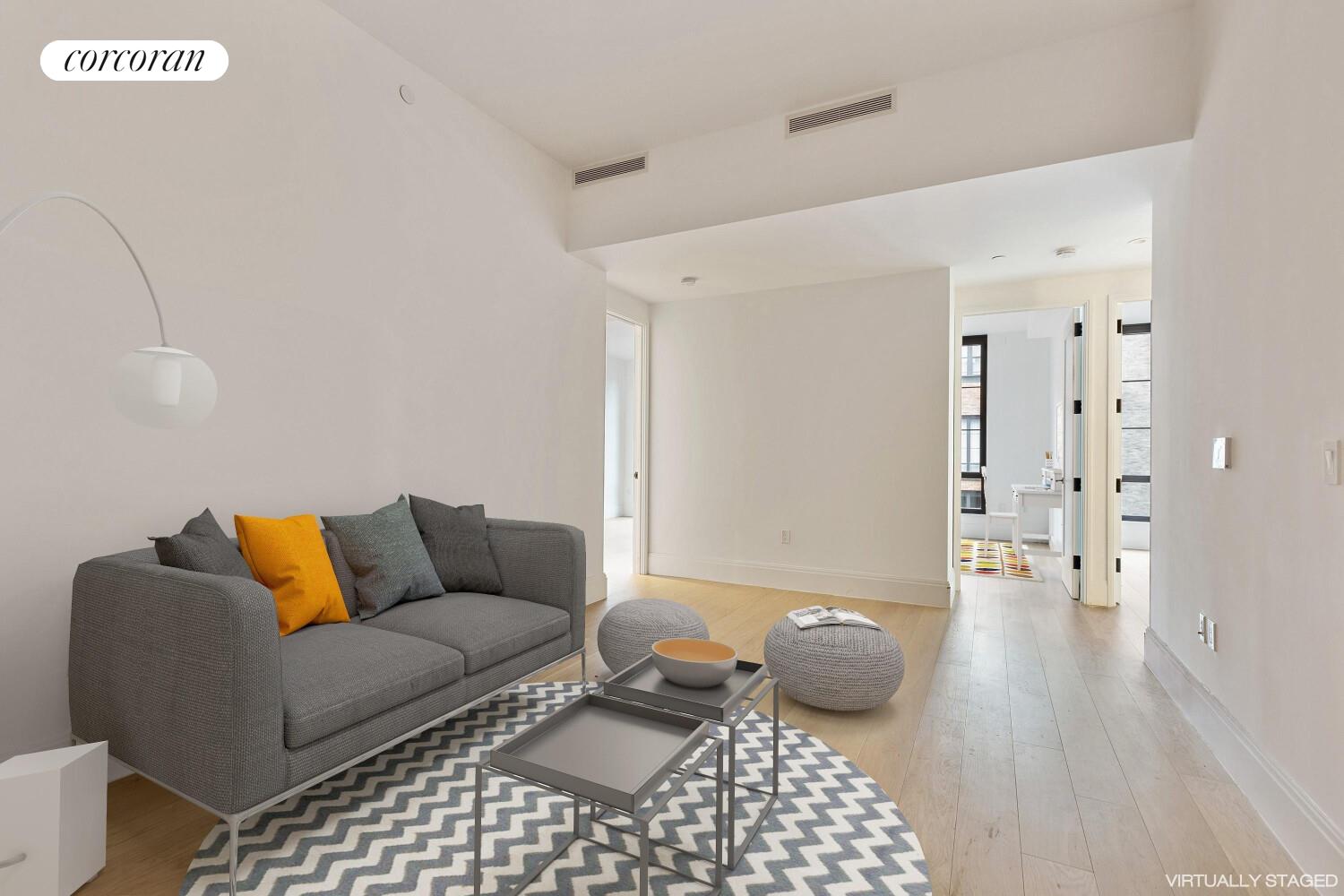 438 East 12th Street, Unit PHH Manhattan, NY 10009 - Photo 12 of 13 a living room with furniture and a rug