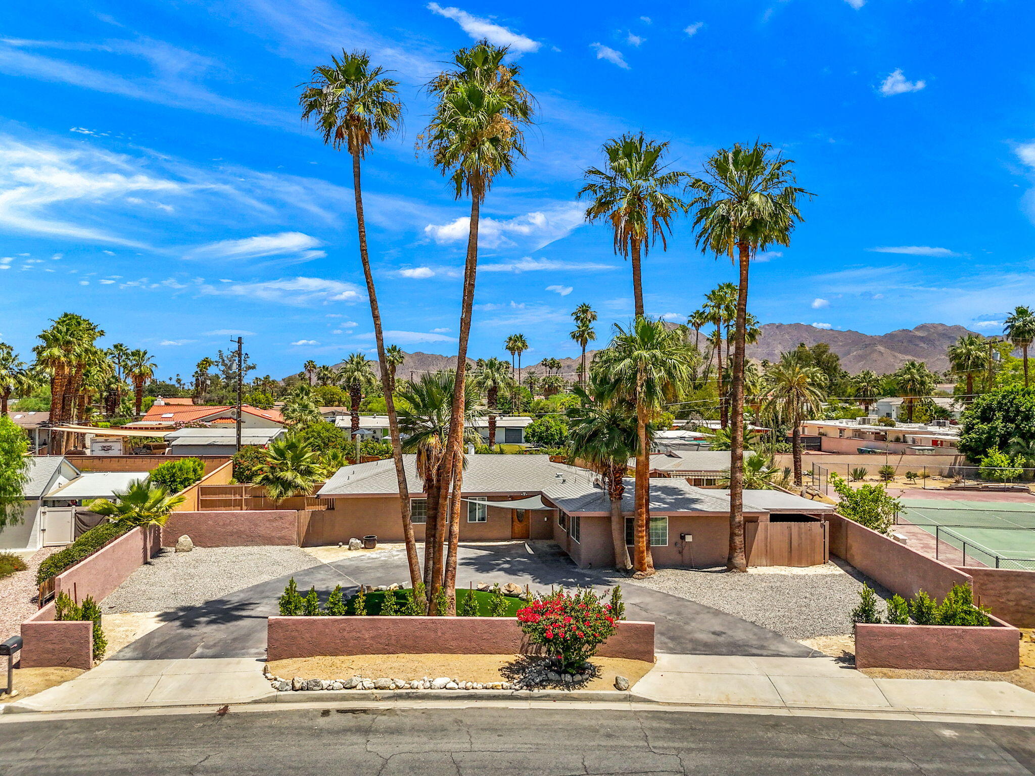 44510 San Carlos Avenue, Unit 4 Palm Desert, CA 92260 - Photo 1 of 12 a view of a city with palm trees