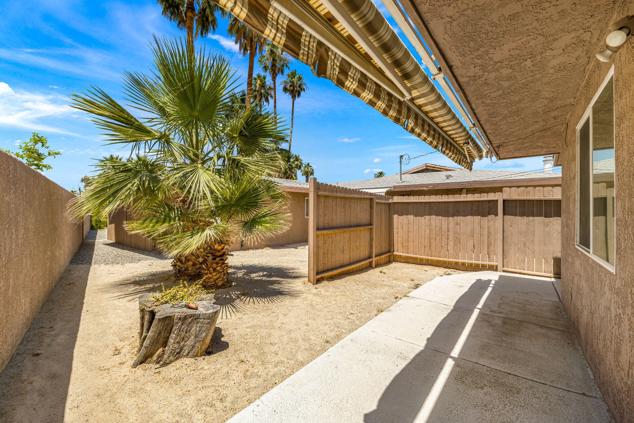 44510 San Carlos Avenue, Unit 4 Palm Desert, CA 92260 - Photo 3 of 12 a view of a porch with a house