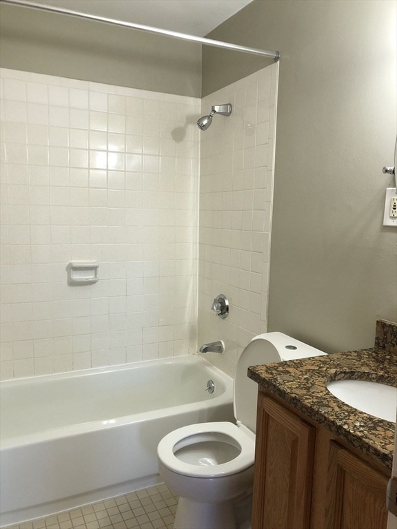 150 St Botolph Street, Unit 32 Boston, MA 02115 - Photo 3 of 8 a bathroom with a granite countertop toilet sink and shower