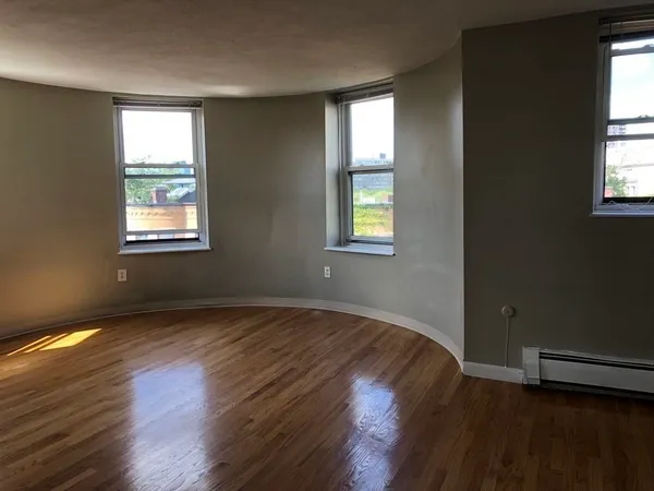 a view of an empty room and window