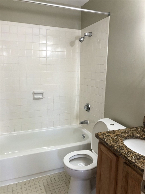 150 St Botolph Street, Unit 32 Boston, MA 02115 - Photo 6 of 8 a bathroom with a granite countertop sink toilet and shower
