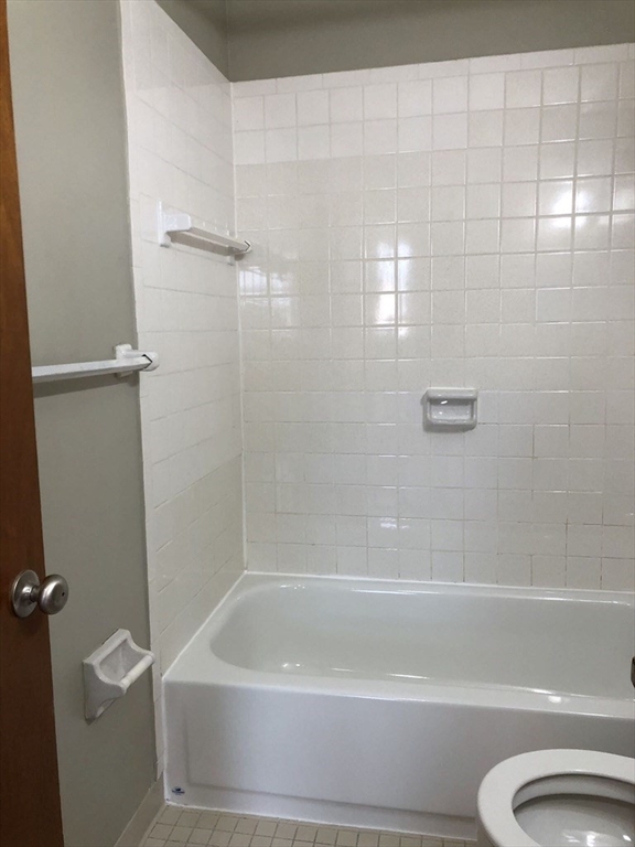 150 St Botolph Street, Unit 32 Boston, MA 02115 - Photo 7 of 8 a bathroom with a shower and a toilet