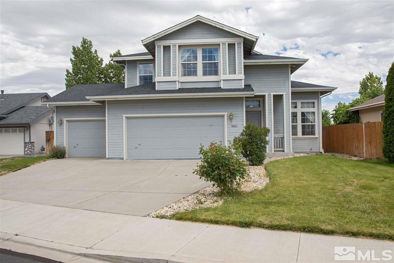 9910 Rock River Drive Reno, NV 89506 - Photo 1 of 24 a front view of a house with garden