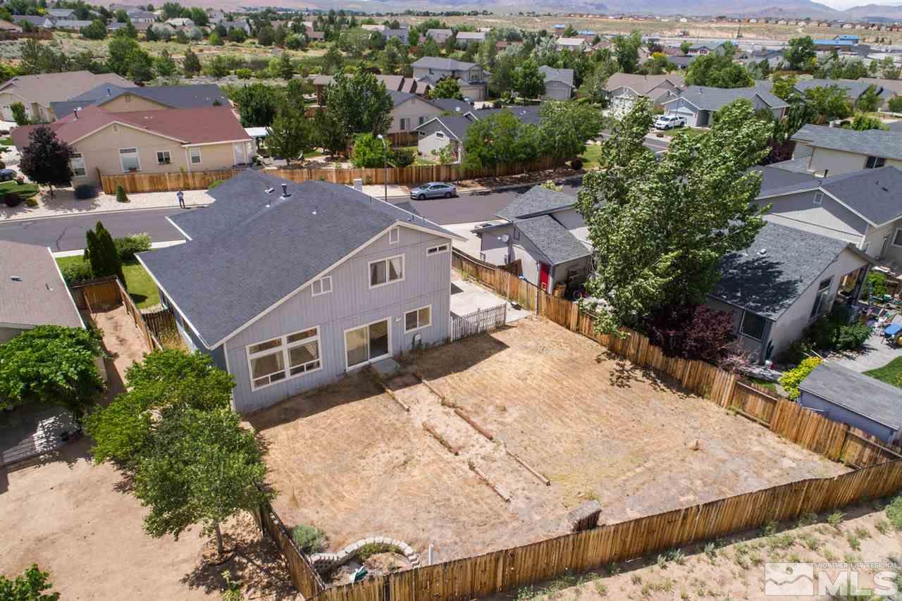 9910 Rock River Drive Reno, NV 89506 - Photo 23 of 24 an aerial view of residential houses with outdoor space and parking