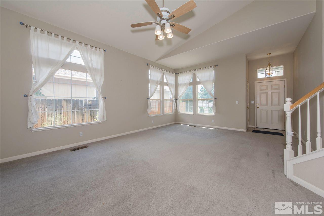 9910 Rock River Drive Reno, NV 89506 - Photo 4 of 24 a view of an empty room with a window
