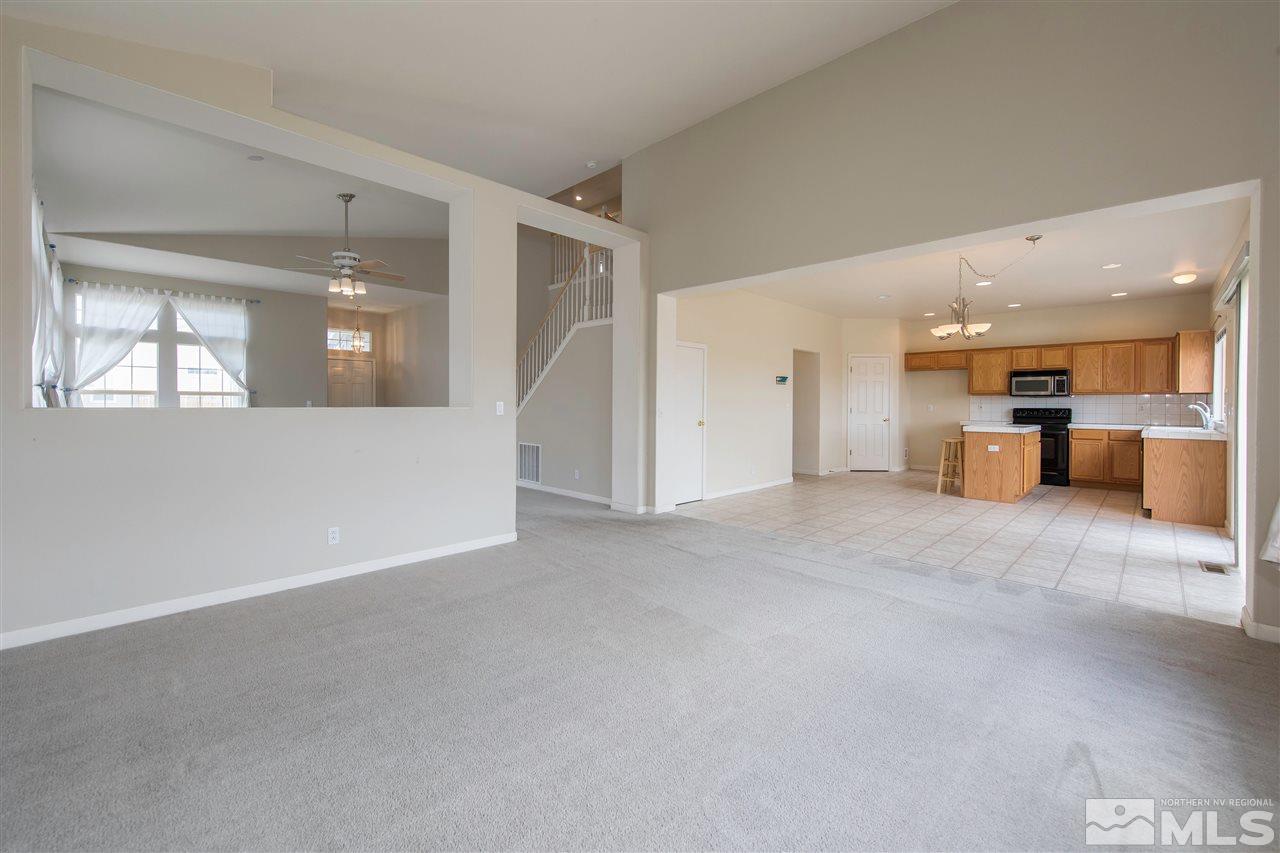 9910 Rock River Drive Reno, NV 89506 - Photo 5 of 24 a view of a livingroom with a kitchen