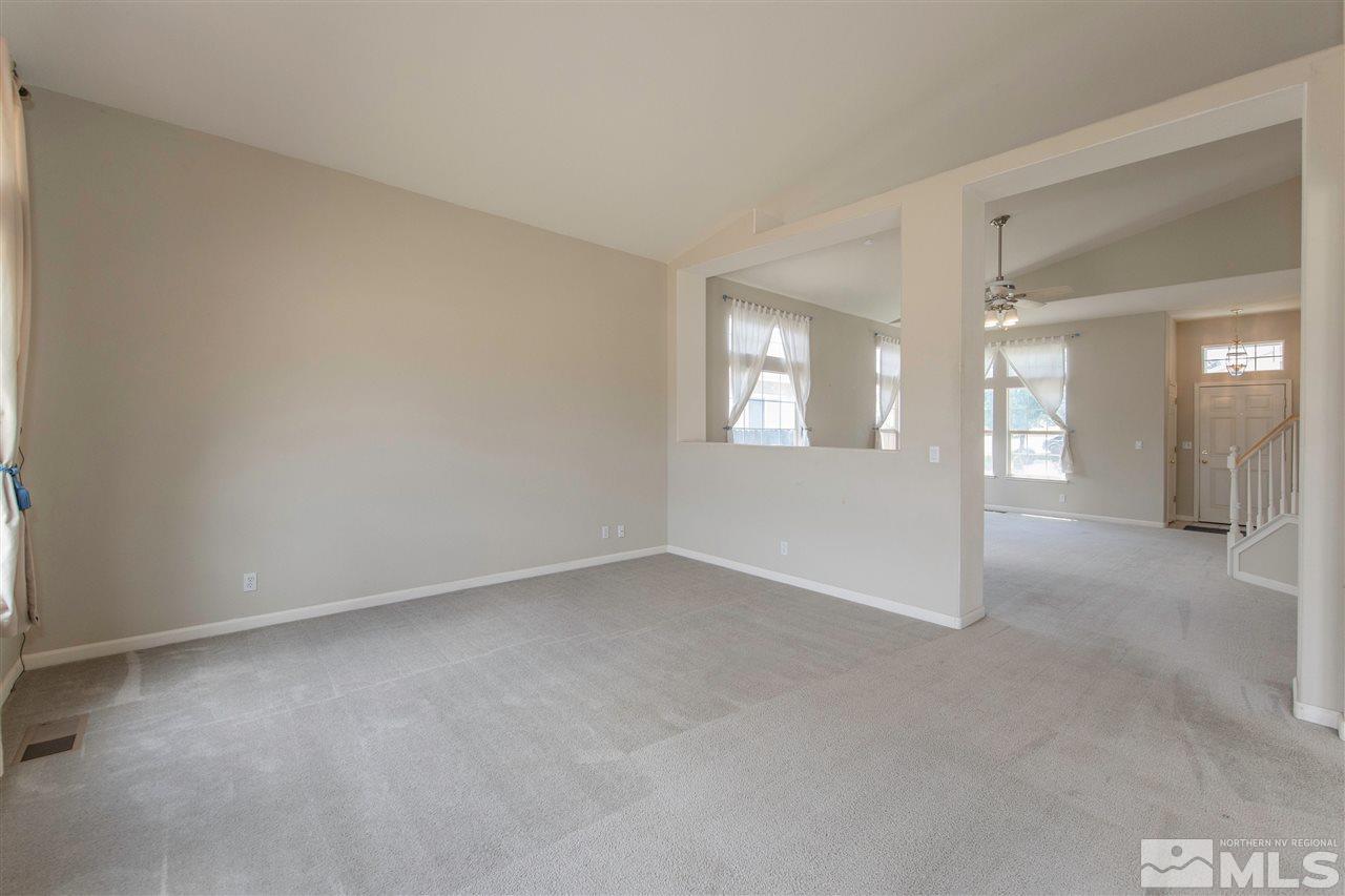 9910 Rock River Drive Reno, NV 89506 - Photo 6 of 24 a view of an empty room with a window
