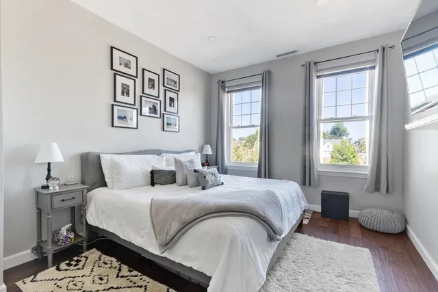 a bedroom with a bed furniture and a window