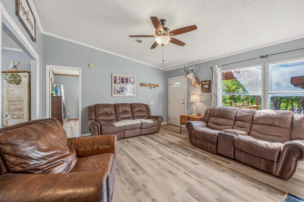 151 High Point Road Weatherford, TX 76088 - Photo 7 of 40 a living room with furniture and a large window