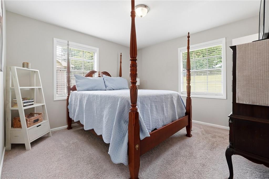 1619 Ridgeview Drive Northwest Conyers, GA 30012 - Photo 12 of 20 a bed room with a bed and a window