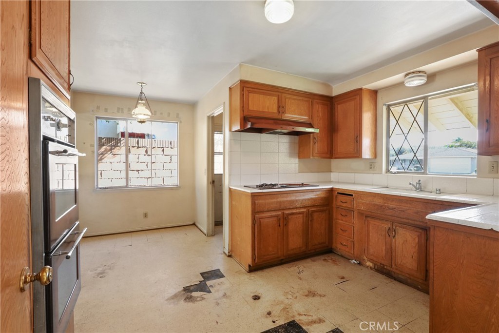 2541 Summershade Drive La Habra, CA 90631 - Photo 6 of 25 a kitchen with stainless steel appliances granite countertop a sink stove and refrigerator