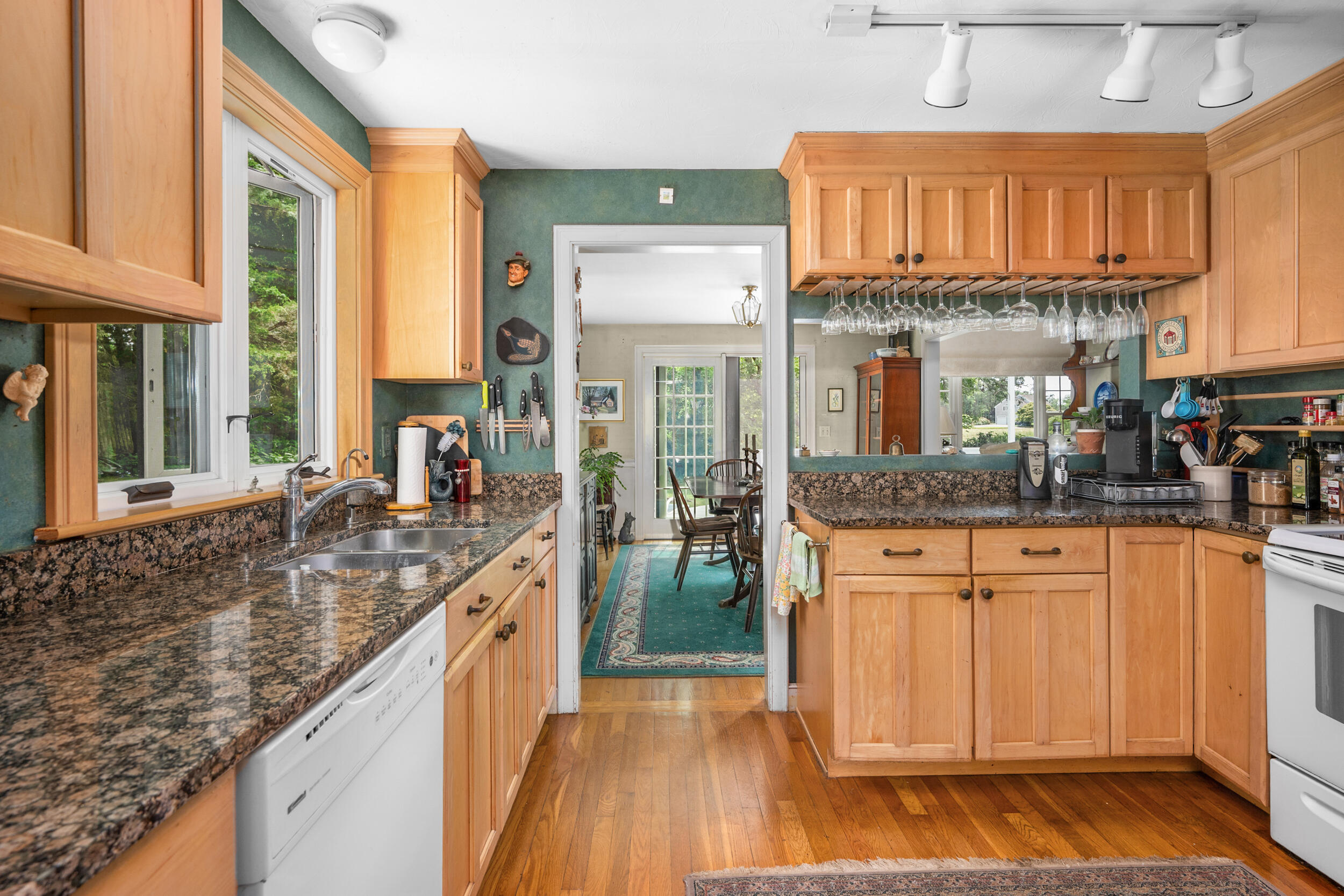 4323 Main Street Barnstable, MA 02630 - Photo 11 of 33 a kitchen with stainless steel appliances granite countertop a stove a sink and a refrigerator