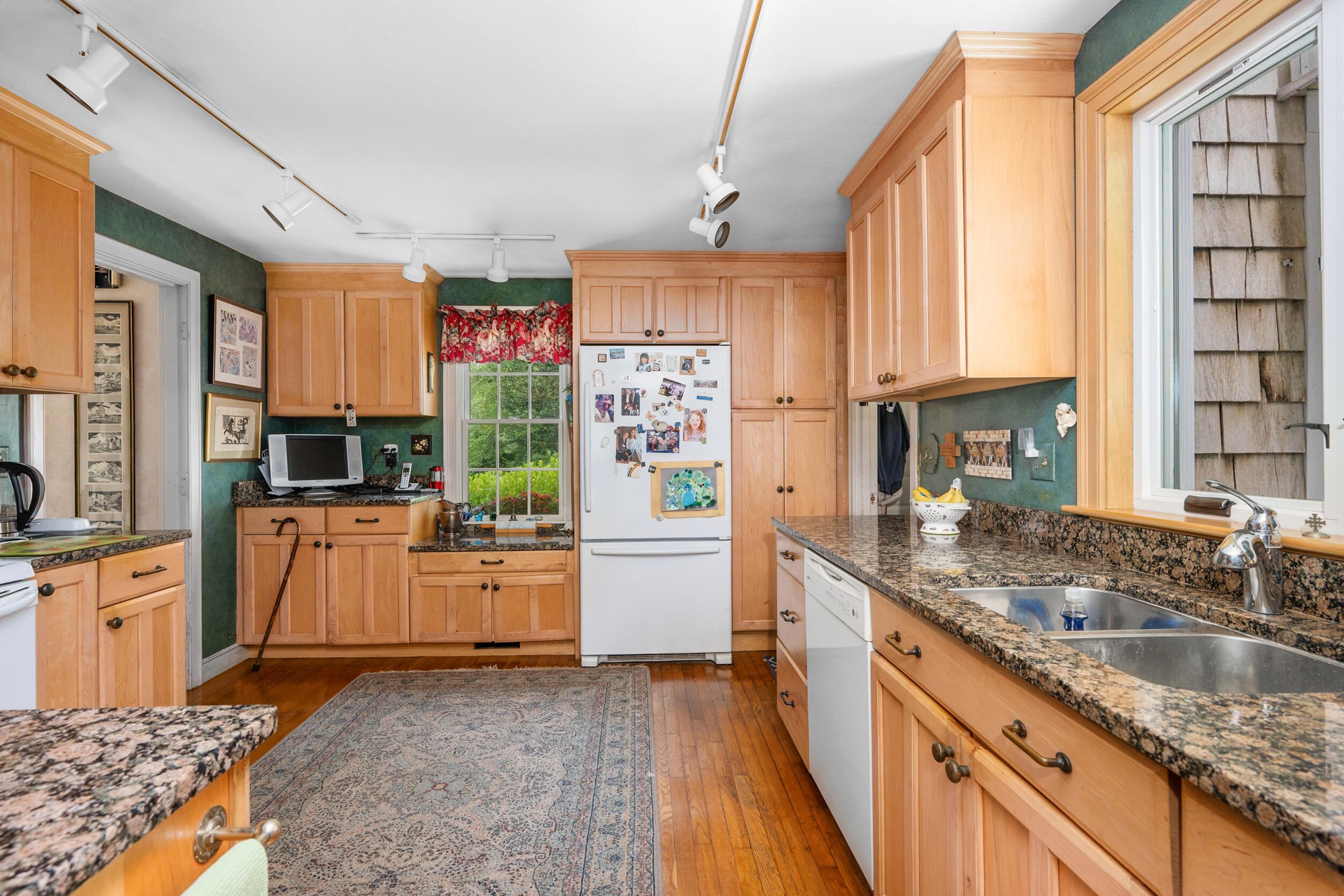 4323 Main Street Barnstable, MA 02630 - Photo 12 of 33 a kitchen with granite countertop a sink stove and refrigerator