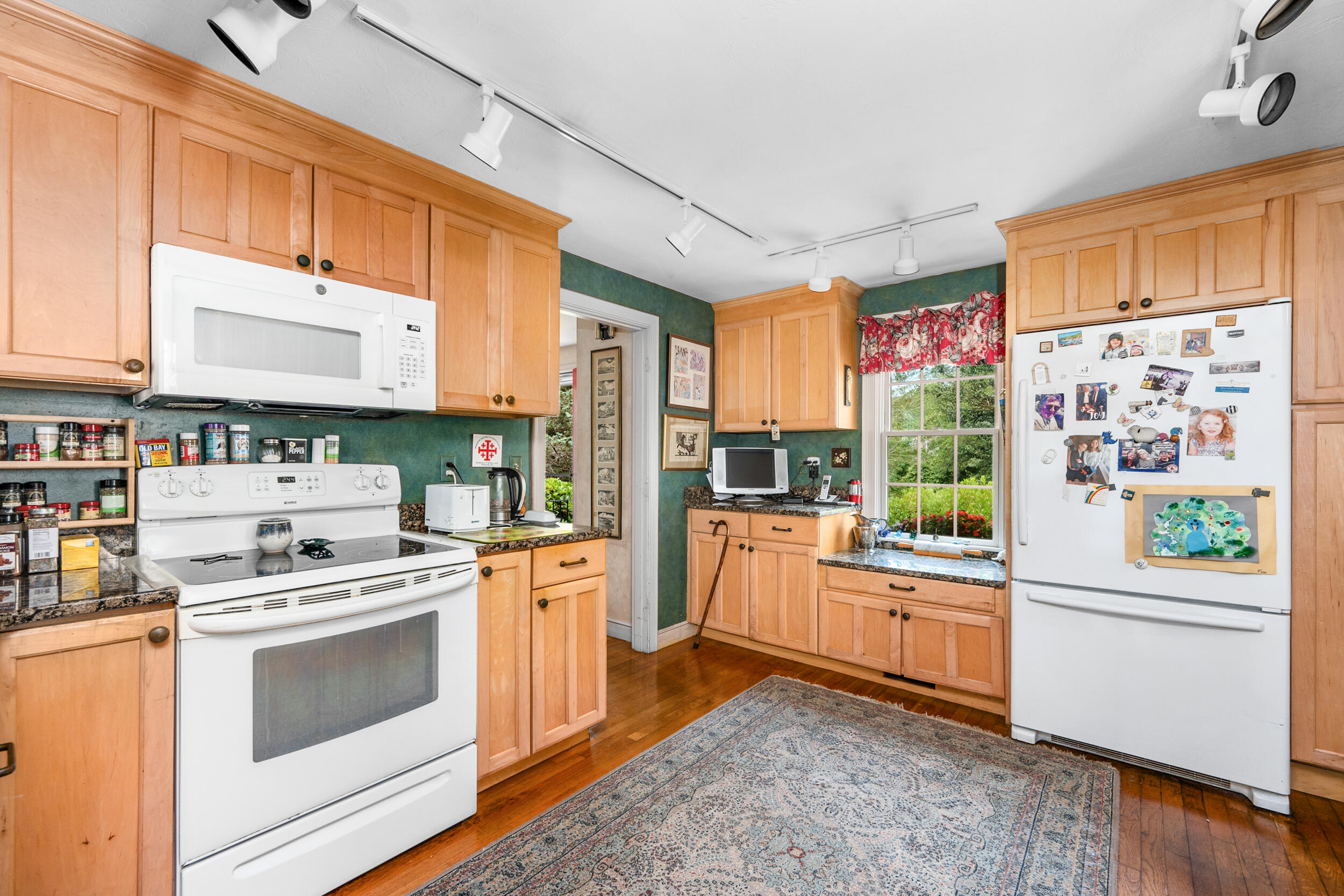 4323 Main Street Barnstable, MA 02630 - Photo 13 of 33 a kitchen with stainless steel appliances a stove a sink and a refrigerator