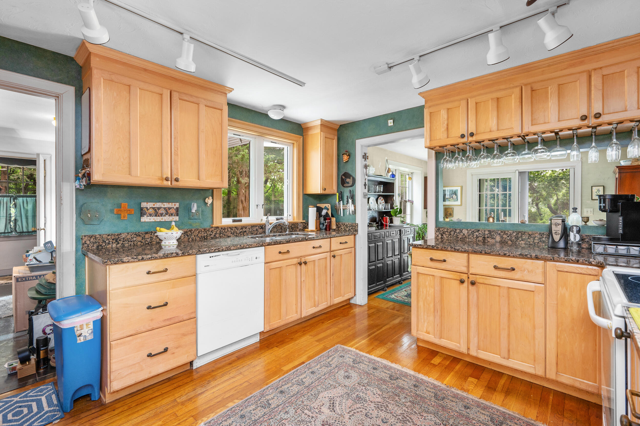 4323 Main Street Barnstable, MA 02630 - Photo 14 of 33 a kitchen with granite countertop a sink cabinets stainless steel appliances and a large window