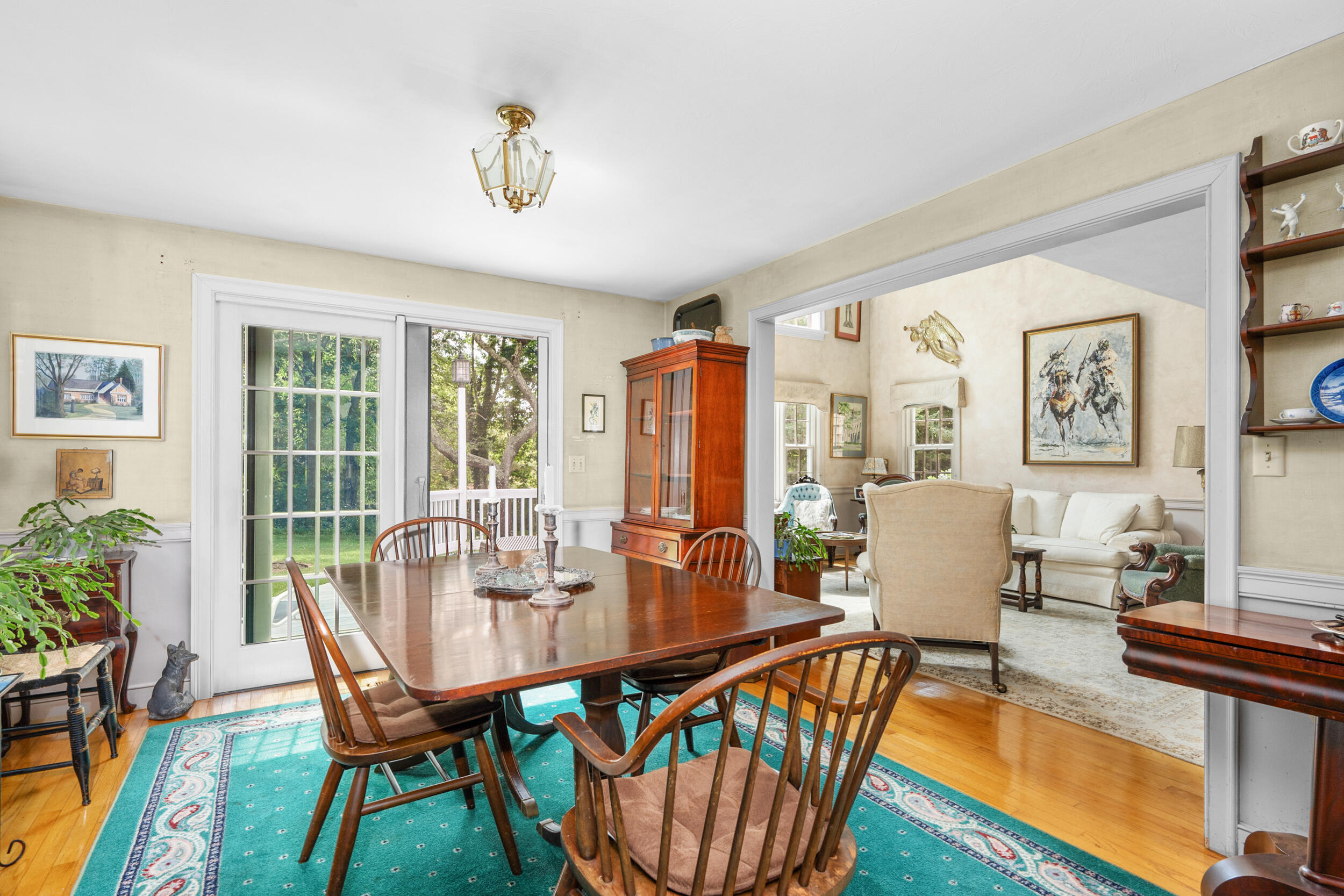 4323 Main Street Barnstable, MA 02630 - Photo 15 of 33 a dining room with furniture a rug and wooden floor
